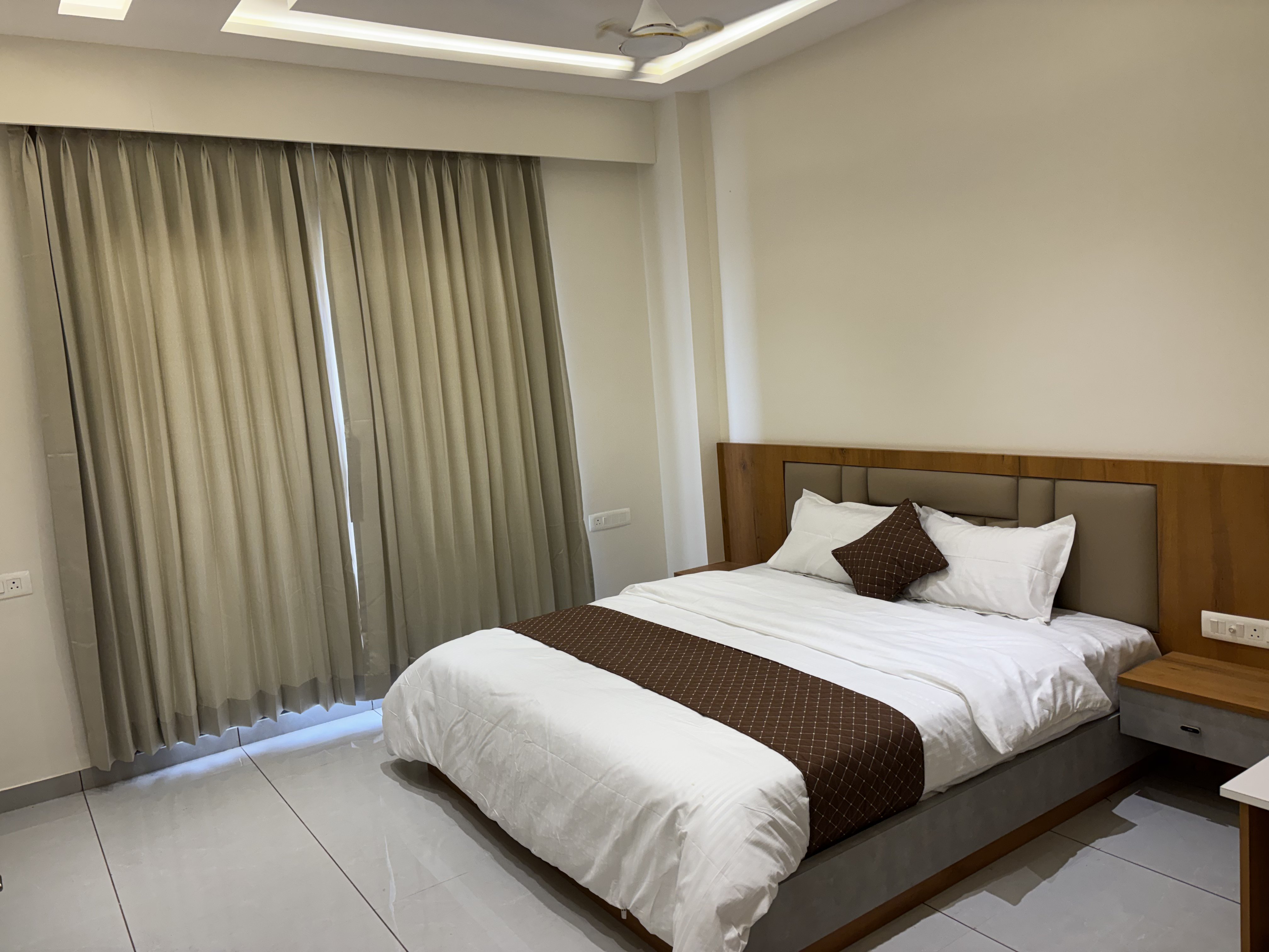 Premium suite with panoramic city views and luxury furnishings